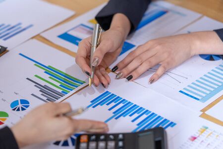 Businesswoman discussion the charts and graphs showing the results of their successful.の写真素材