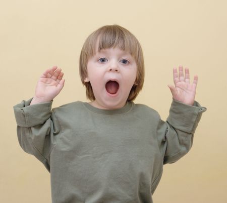 surprised little boy with opened mouth の写真素材