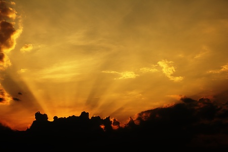 orange sky with sun rays の写真素材