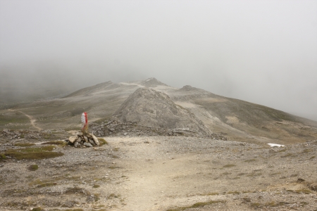 high Alpine path marked with red and white paintの写真素材