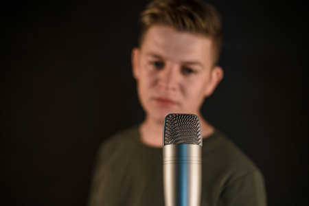 guy and microphone singing in studioの写真素材