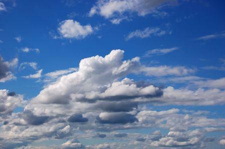 The blue sky with white cloudsの写真素材