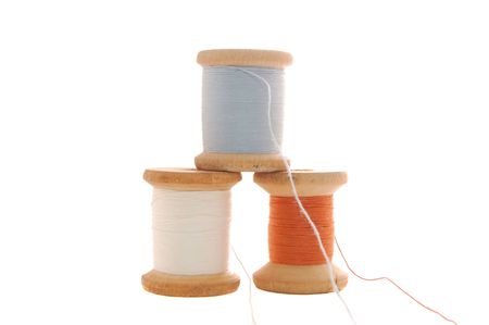 spools with threads isolated on the whiteの写真素材
