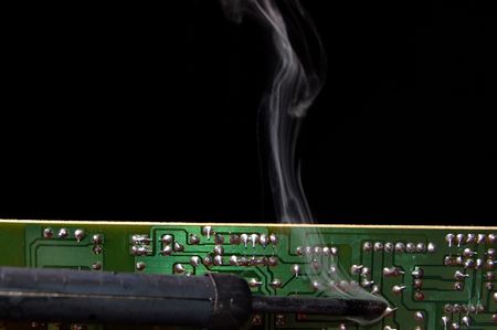 Soldering a circuit boardの写真素材