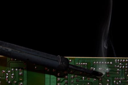 Soldering a circuit boardの写真素材