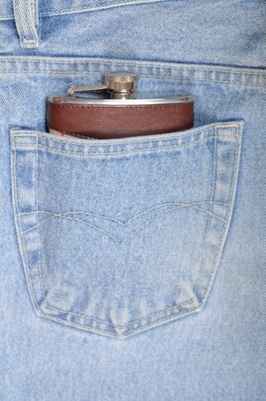 Flask close up in a hip-pocket of jeansの写真素材