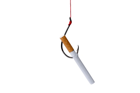 A filtered cigarette hooked to a fishing hookの写真素材