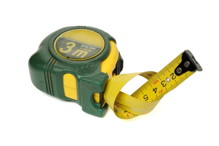 Measuring tape is twisted in knot isolated on a white