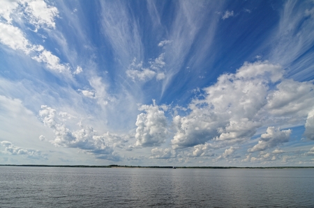 Cloudy sky on the riverの写真素材