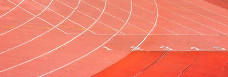 On the starting line of the track and field, tracks 1 to 5 are waiting for their respective players to take their placeの写真素材
