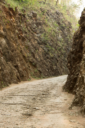 Old rail pass between cliffの写真素材