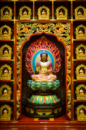Very beautiful and mystical China buddha statue is decorated in the wall at Buddha Tooth Relic temple, Singapore.のeditorial素材