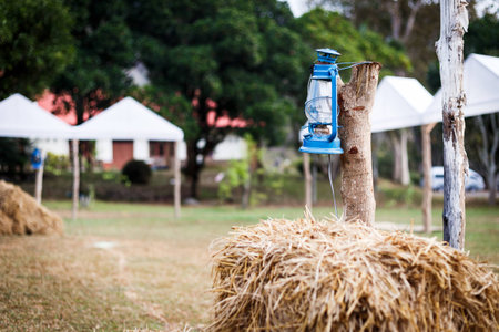 Some resort decorate their place in contry theme. They use old lantern, straw, well and backdrop that relate to cowboy style.の写真素材