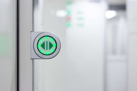 Green light on the glass door in train