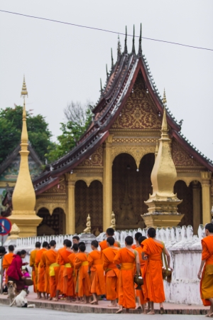 Morning at Luang Prabang for Buddhist offer some food to monkのeditorial素材