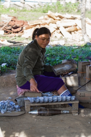 Chiang Kwang Laos 28 December 2012, Here the people manufacturing tablespoons of bomb.のeditorial素材