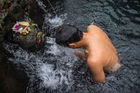 Holy spring water in Tirta Empul temple, Bali, Indonesia , Bali people must to bath for clean spilitの写真素材