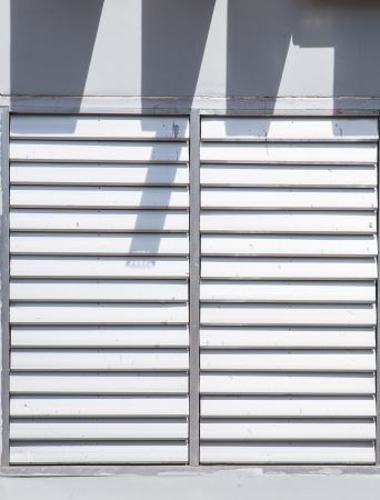 Window with white shuttersの写真素材