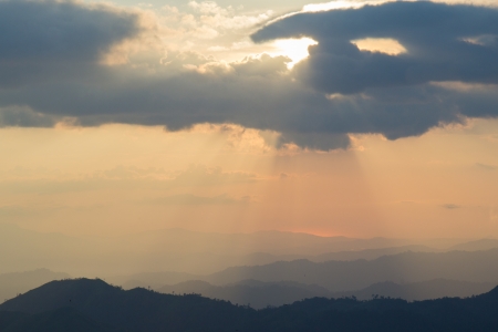 Sky through the cloud and sun beamの写真素材