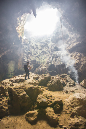 Man inside a cave in Thailandの写真素材