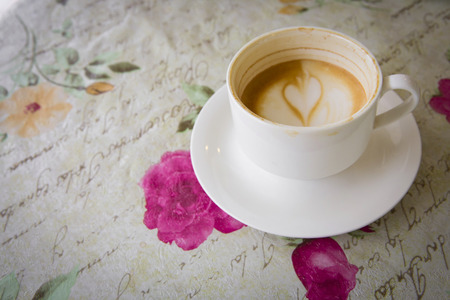 Latte art coffee heart milk design , half drank in the cupの写真素材