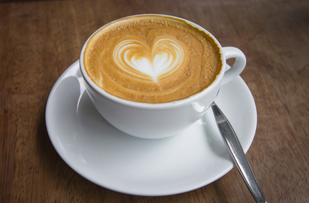 Heart  on coffee made from milk with Espresso coffeeの写真素材