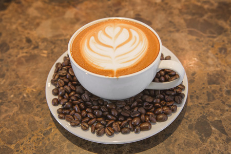 Coffee  latte art  with coffee bean at coffee shopの写真素材