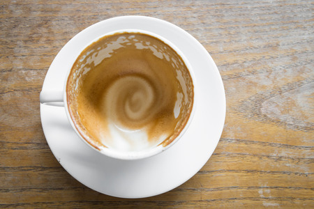 Empty coffee cup on wood table at coffee shopの写真素材