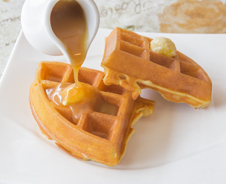 Waffle with caramel sweet in cafeの写真素材