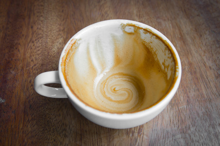 An empty cup coffee on wood tableの写真素材