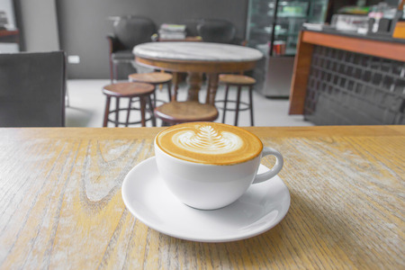 cup of coffee on table in cafeの写真素材