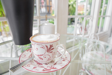 cup of coffee on table in cafeの写真素材