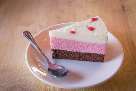 raspberry cake on wood tableの写真素材