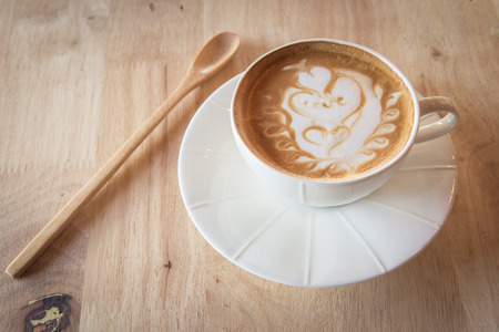 Coffee with wood spoon on tabelの写真素材