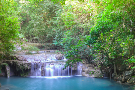 Deep forest waterfall at Erawan waterfall National Park Kanjanaburi Thailandの写真素材