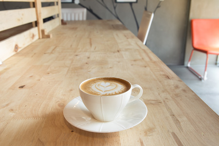 Cup of coffee on table in cafeの写真素材