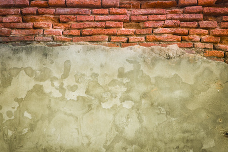 cracked concrete vintage brick wall backgroundの写真素材