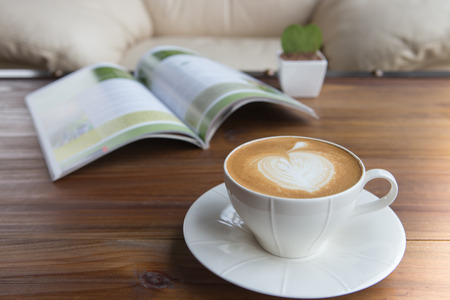 Coffee latte with a book in coffee shopの写真素材