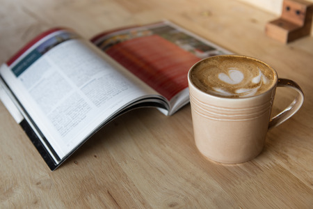 Coffee latte with a book in coffee shopの写真素材