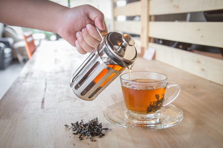 Tea poured into cup onの写真素材