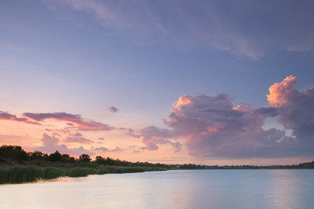 Beautiful sunset with amazing cloud at riverの写真素材