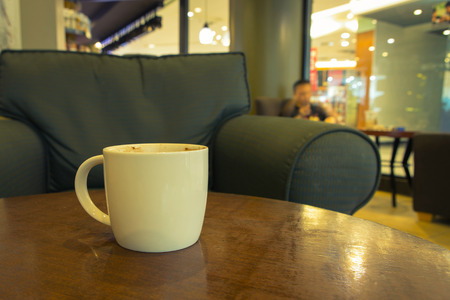 cup of coffee on table in cafeの写真素材