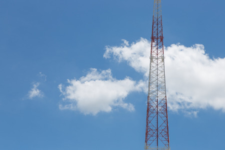 Mobile tower communication antennas with blue sky backgroundの写真素材
