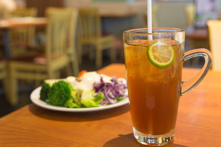 glass of ice tea with lemonの写真素材