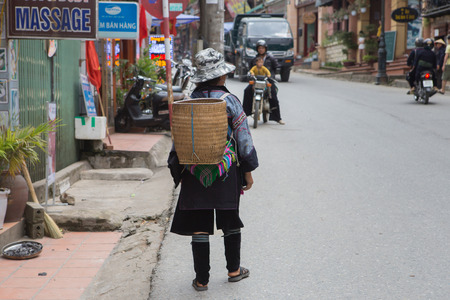 SAPA, VIETNAM -June 16: Hmong woman at a market on June 16, 2015 in Sapa. Sapa is famous for its rugged scenery and its cultural diversity. Hmong people are one of many colorful tribes.のeditorial素材