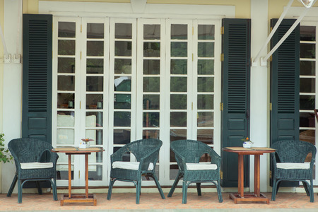 Chair with table in front of cafe shopの写真素材