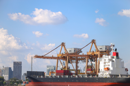 Cargo ship working with crane at portの写真素材