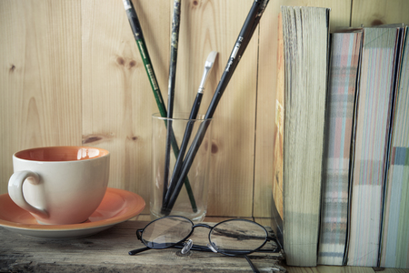 Glasses with cup of coffee and books , Low key toneの写真素材