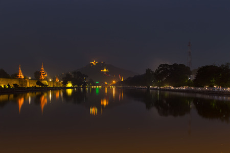 Night view of Mandalay cityscape with famous Fort or Royal Palace. Myanmar (Burma) travel landscapes and destinationsの写真素材