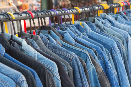 Selective focus jeans of shirt on rackの写真素材